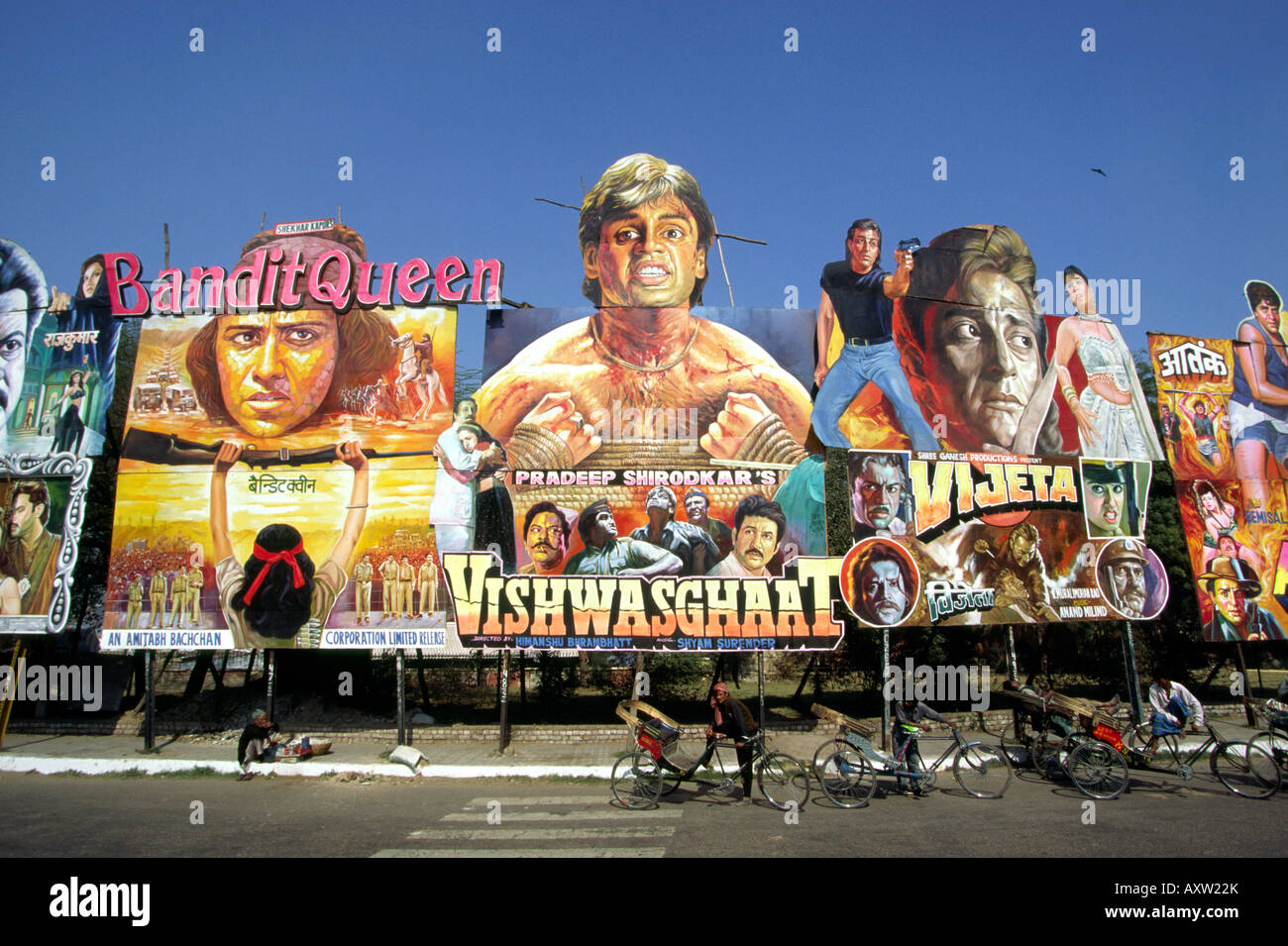 India Old Delhi cycle rickshaws beneath gigantic cinema posters on Nataji Subhash Stock Photo