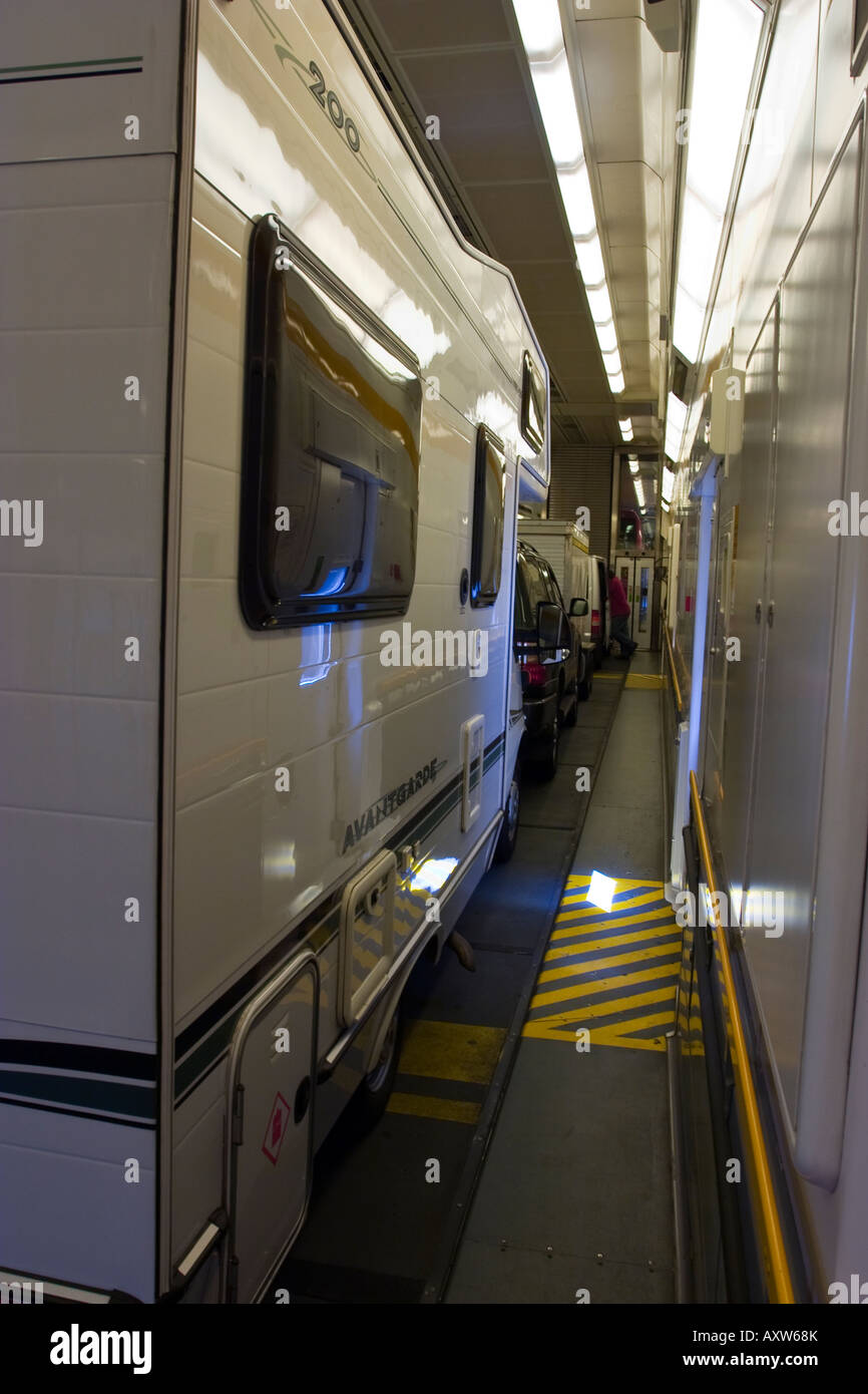 Camper van and caravan on train carriage in Channel Tunnel Stock Photo