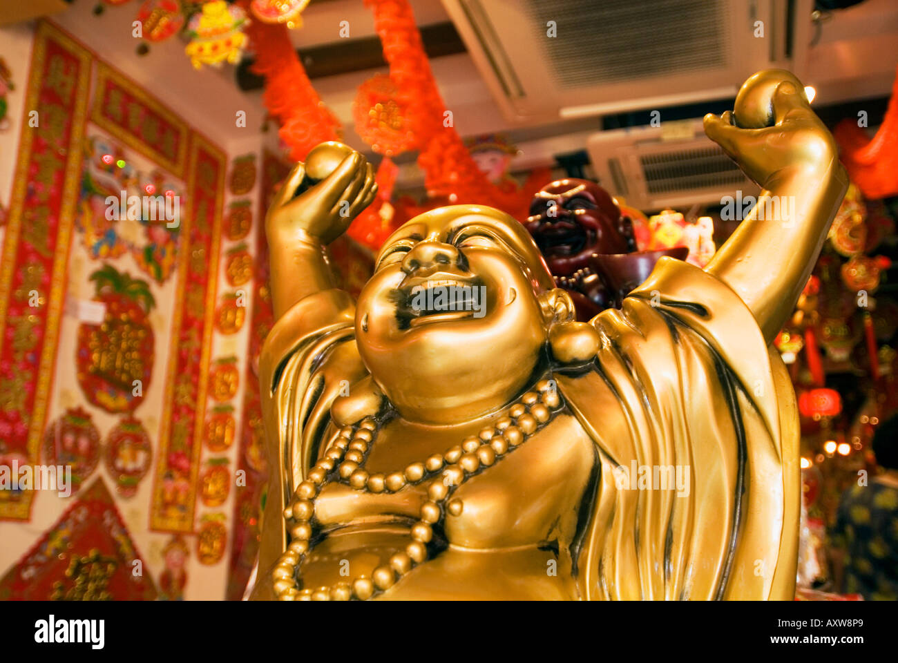 Laughing buddha statue singapore High Resolution Stock Photography and