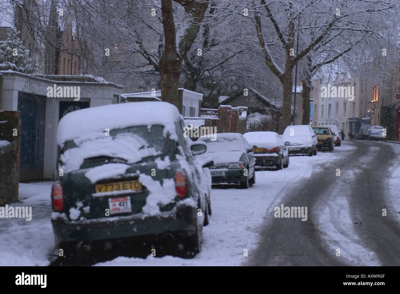 Cars parked on the street in snow, Bristol UK. Stock Photo