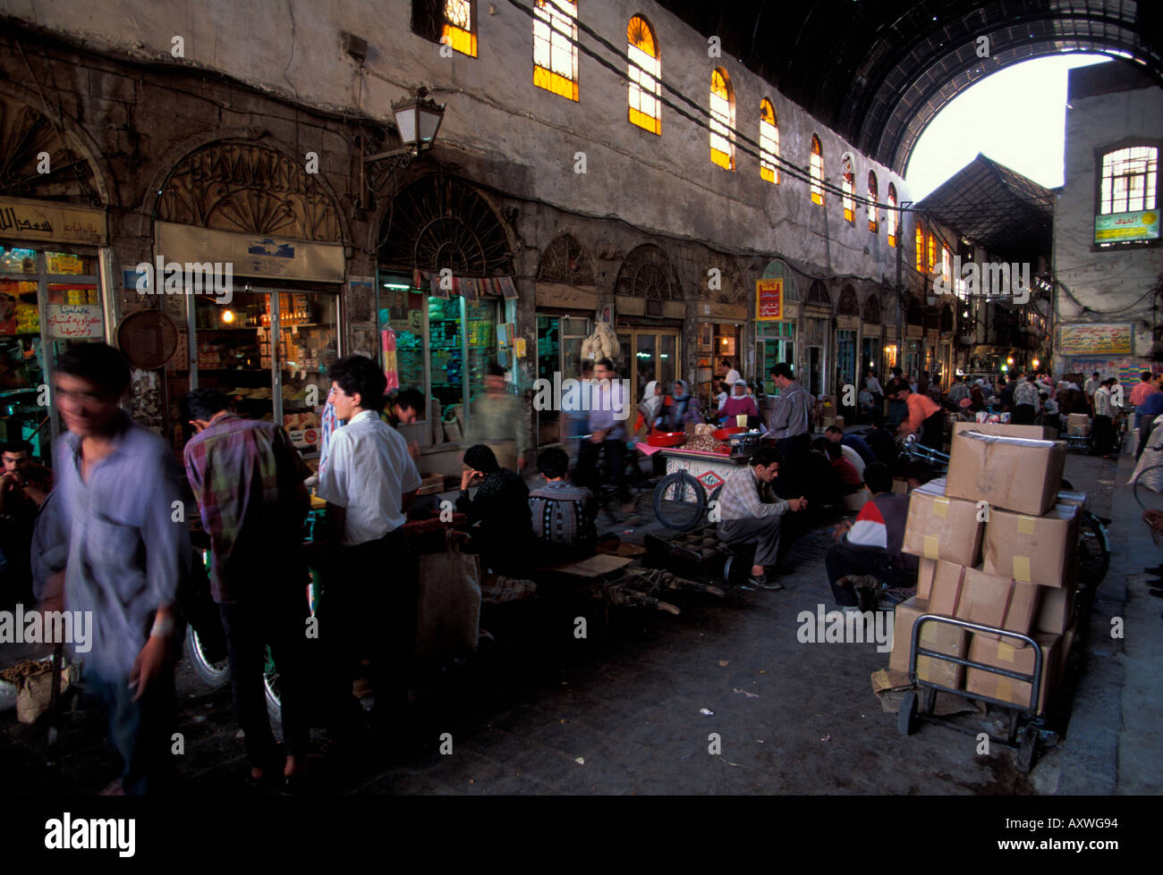 Vendors and shops on busy side street off Straight street Damascus