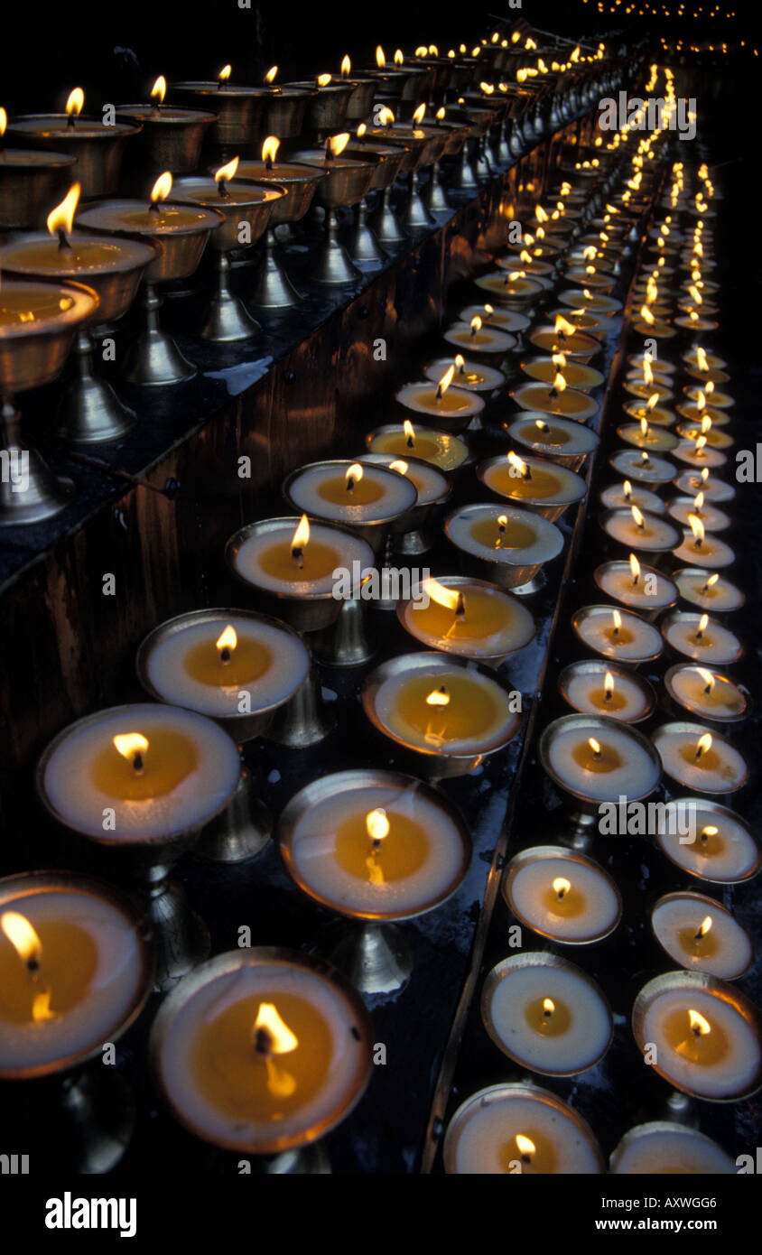 rows burning yak butter votive Buddhist prayer candles Jokhang temple
