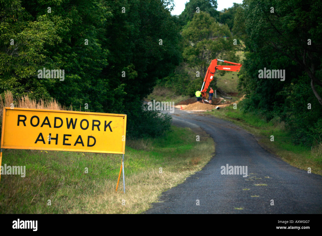 Roadwork ahead sign on country road near Byron bay NSW Australia Stock Photo