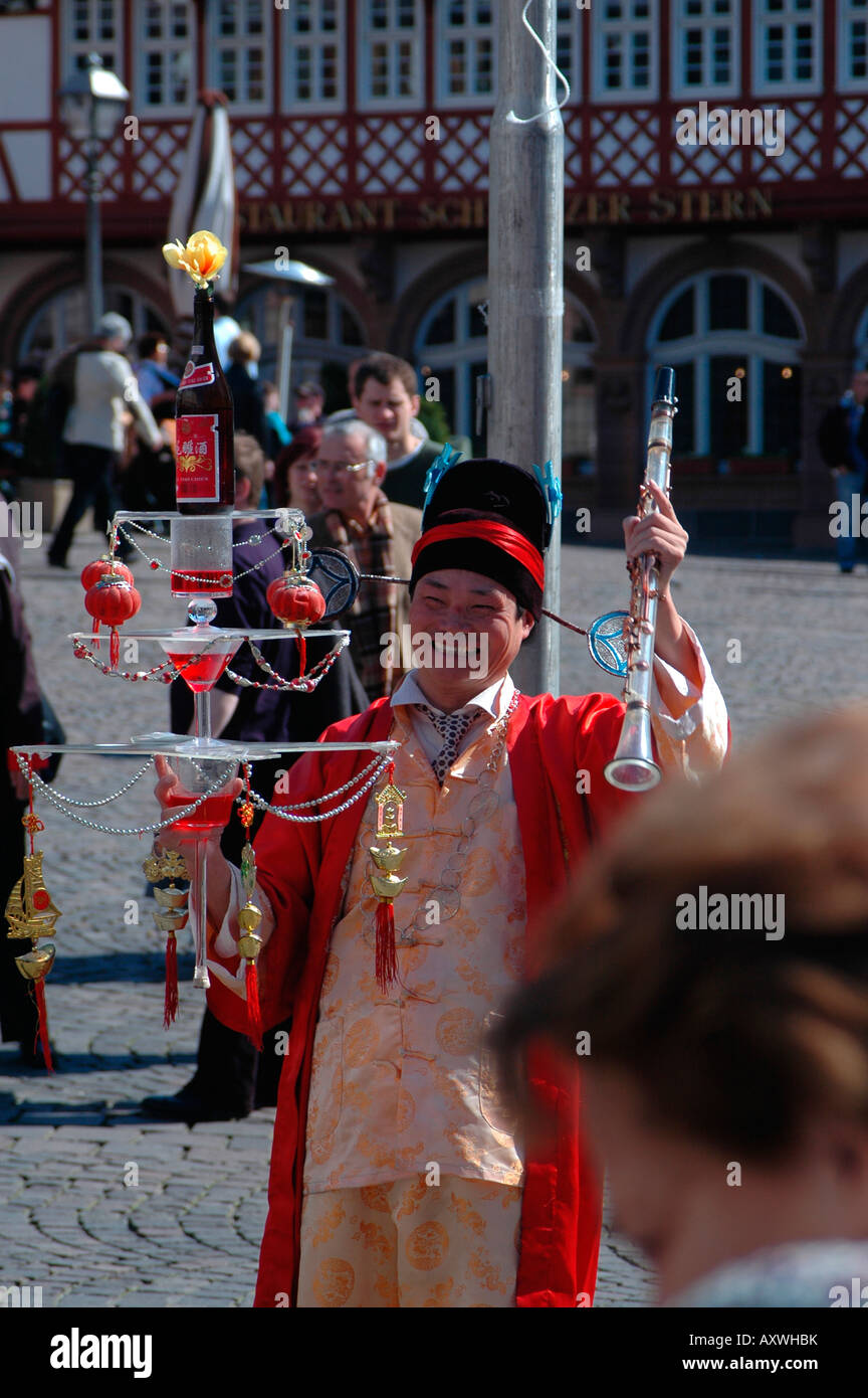 Chinaman showing juggling abilities at Roemer Frankfurt Germany Stock Photo
