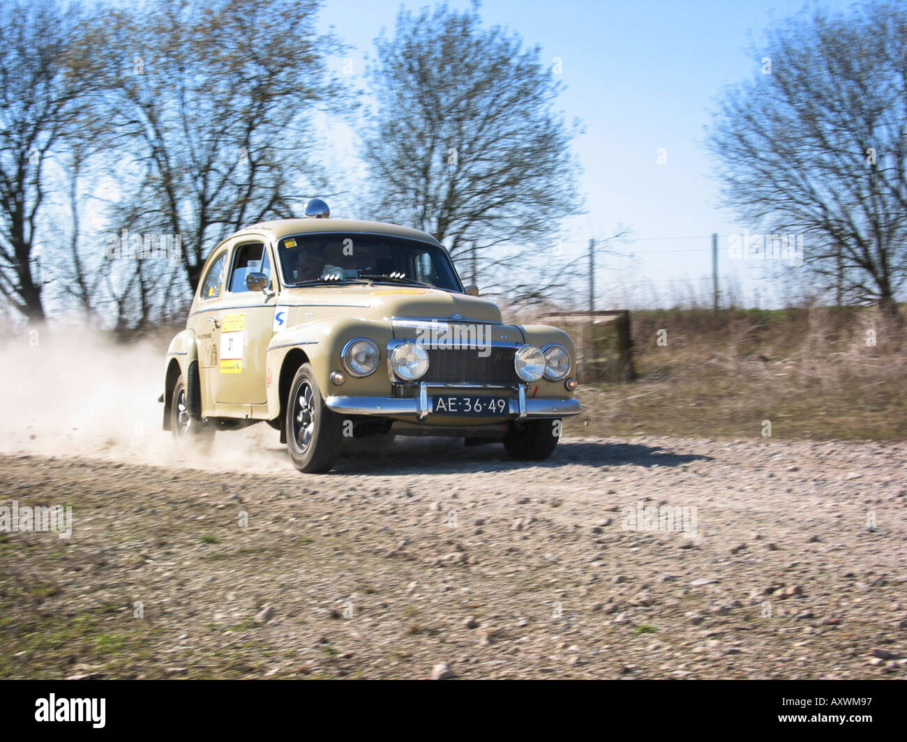 beige rally Volvo 544 at speed on gravel road International Horneland Rally Netherlands Stock Photo