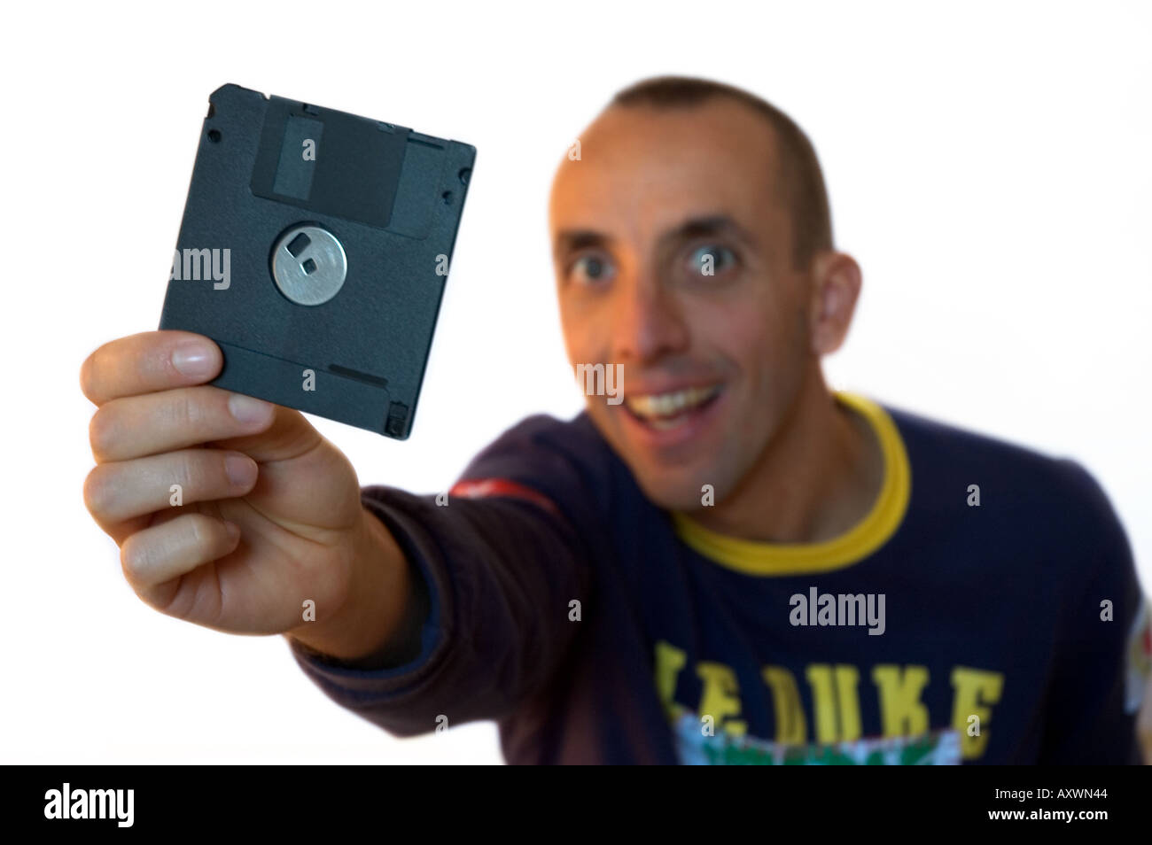 man have a floppy disk in his finger Stock Photo Alamy