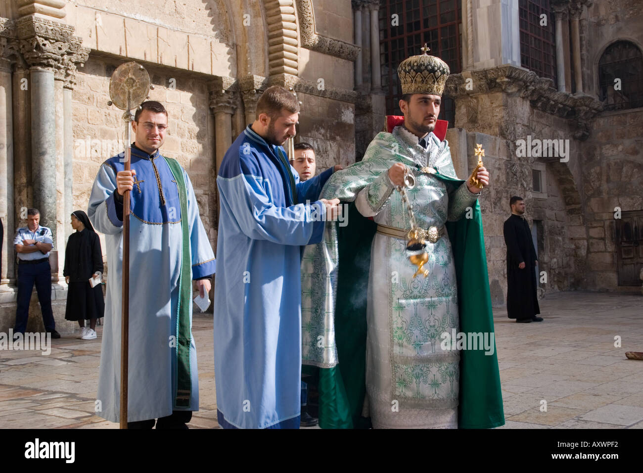 Priest and boys at Armenian Christian ceremony in Jerusalem, Israel