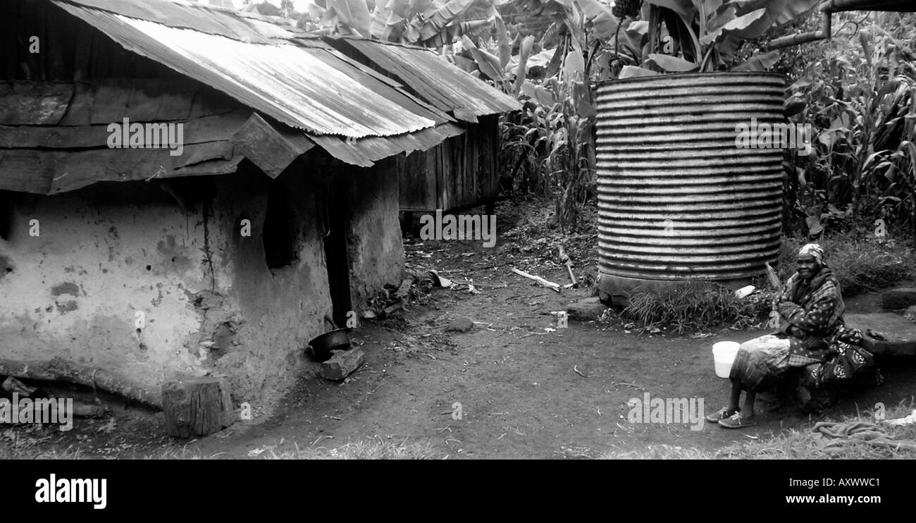 African women sitting outside hut in Kenya Stock Photo