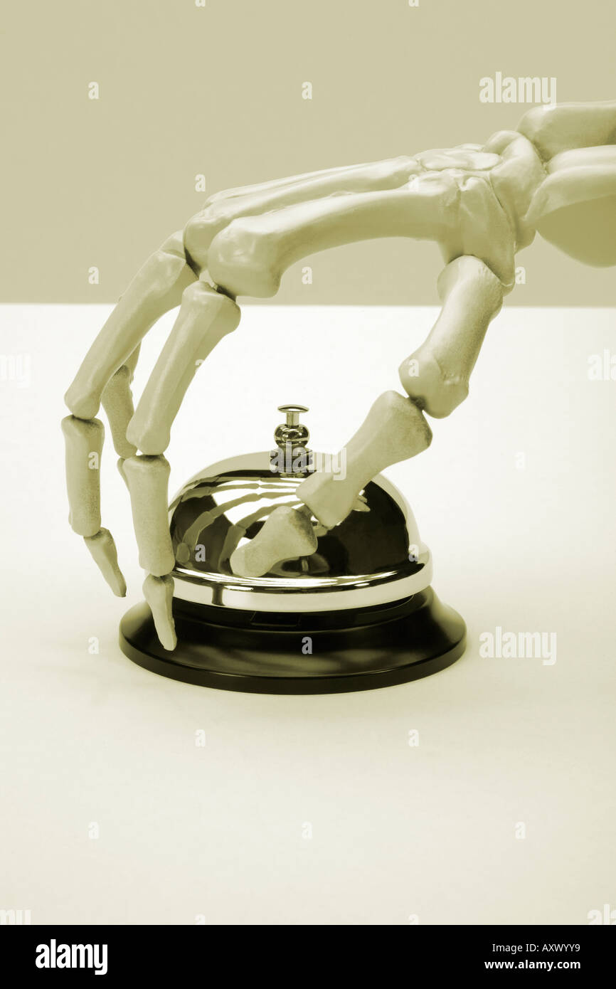 Human skeleton hand pressing service bell sepia toned black and white ...