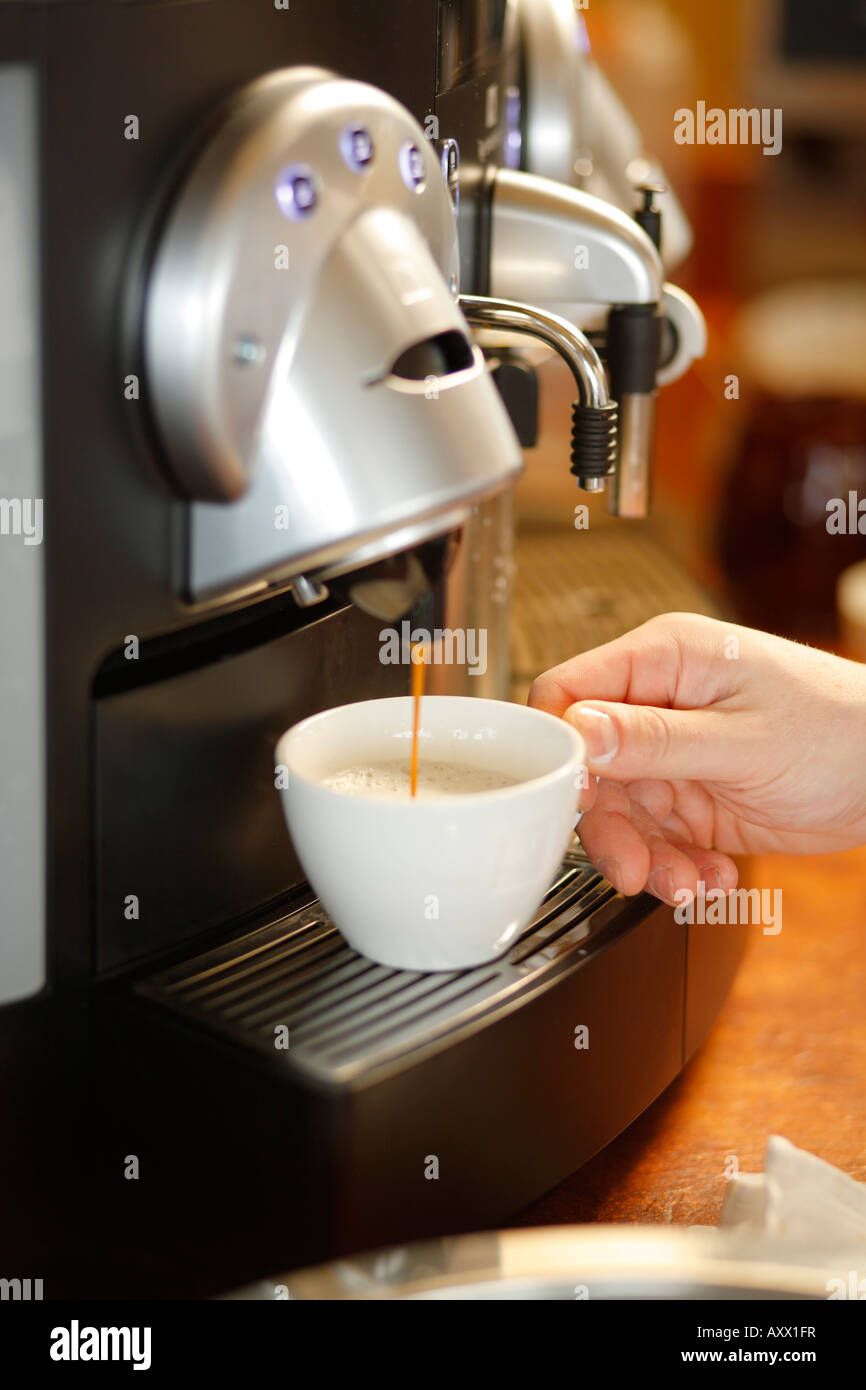 Brewing coffee in espresso machine Stock Photo Alamy