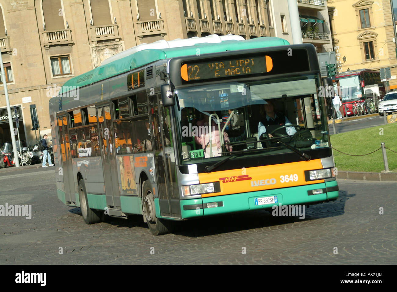 A gas powered bus makes its way through the streets of Florence, Tuscany, Italy. Stock Photo