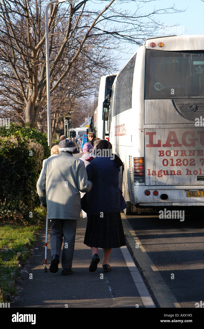 Elderly passengers getting on a coach in the UK Stock Photo Alamy