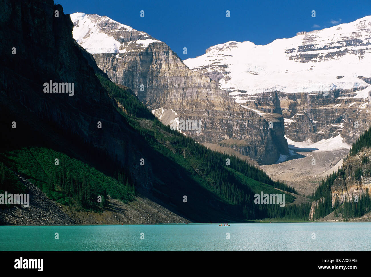 View to Mount Victoria across the emerald waters of Lake Louise, in summer, Banff National Park, Alberta, Canada Stock Photo