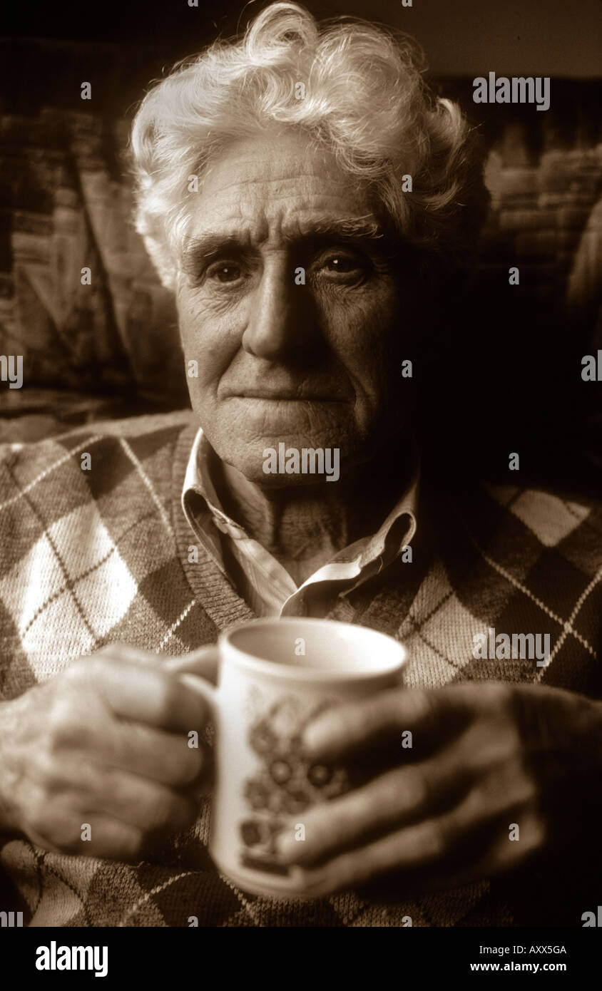 Old Man Holding A Mug Of Tea Stock Photo Alamy