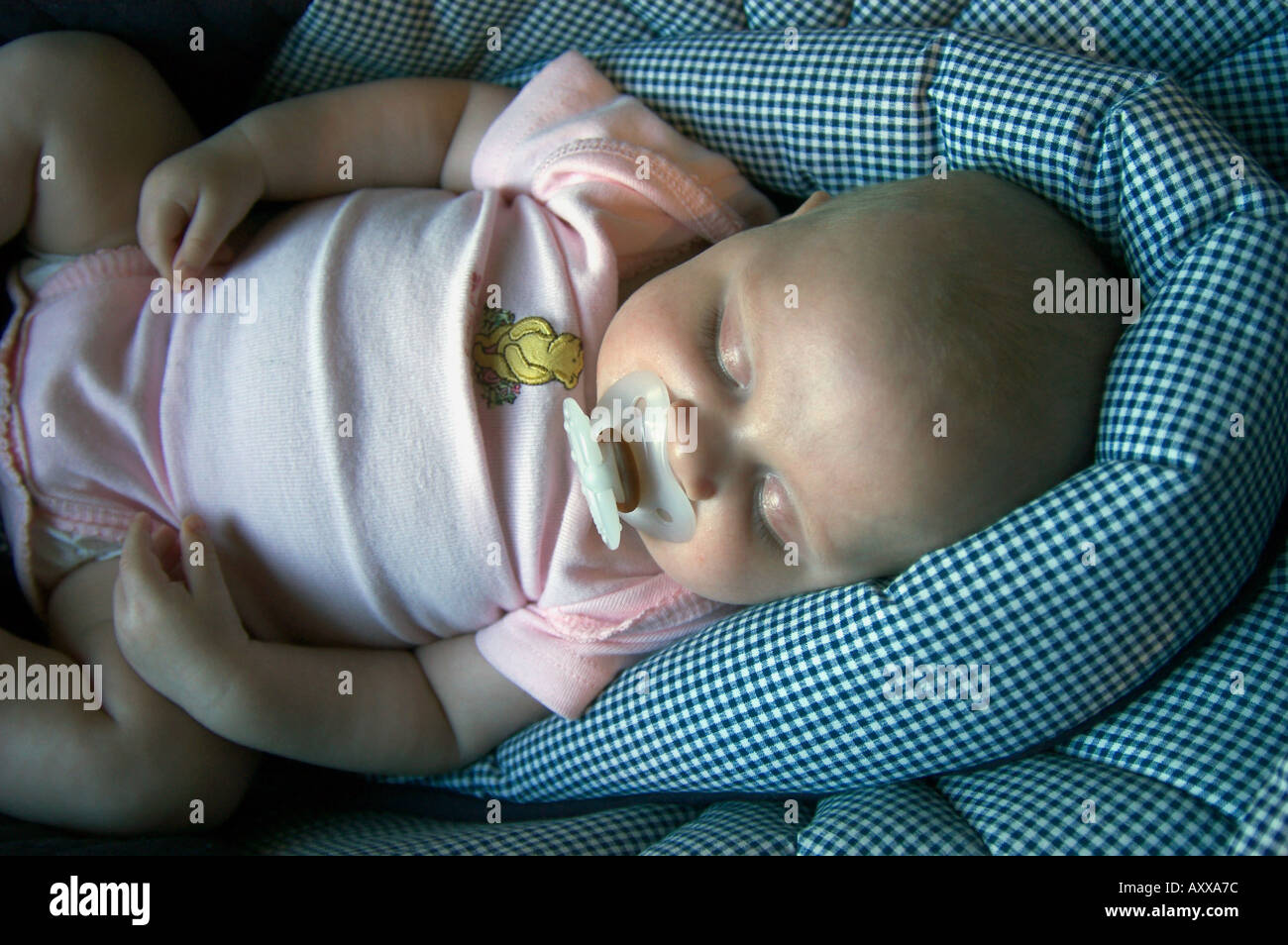Newborn baby girl sleeping pacifier hi-res stock photography and images ...
