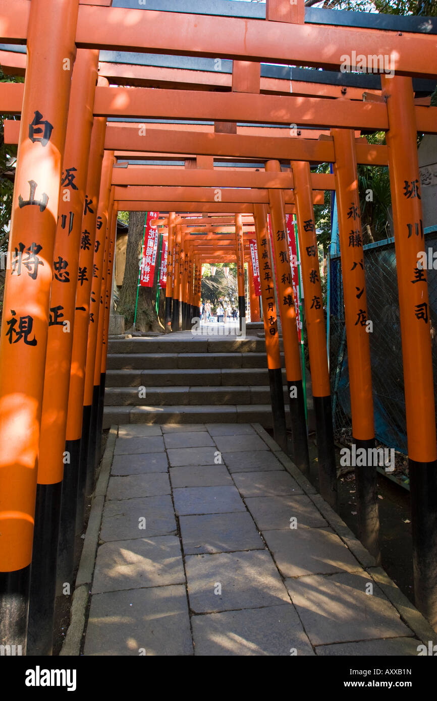 Series of orange torii gates along a passageway in Ueno Park Tokyo Japan Stock Photo