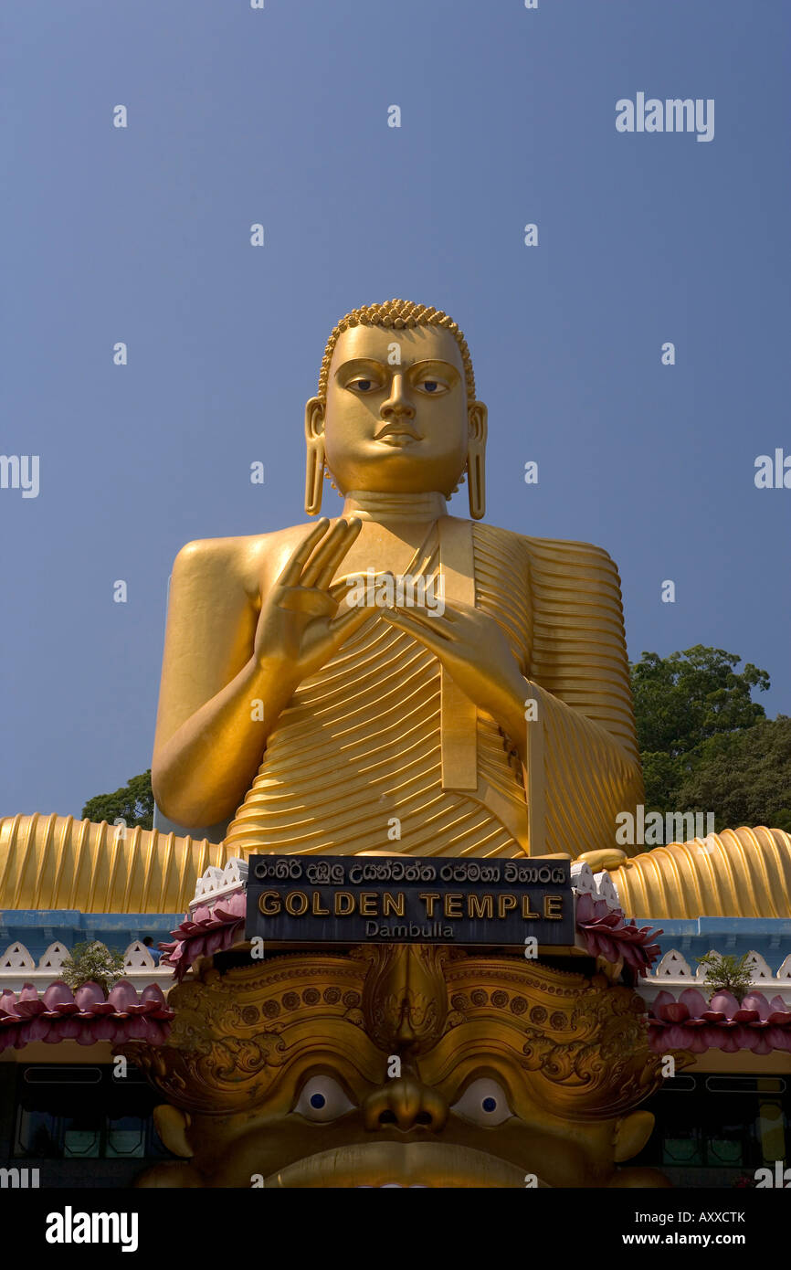 Giant gold seated Buddha statue at entrance to the Cave Temples, Golden
