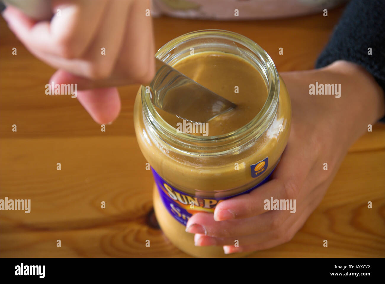 Smooth Peanut Butter On A Knife Stock Photo, Picture and Royalty Free  Image. Image 66063062.