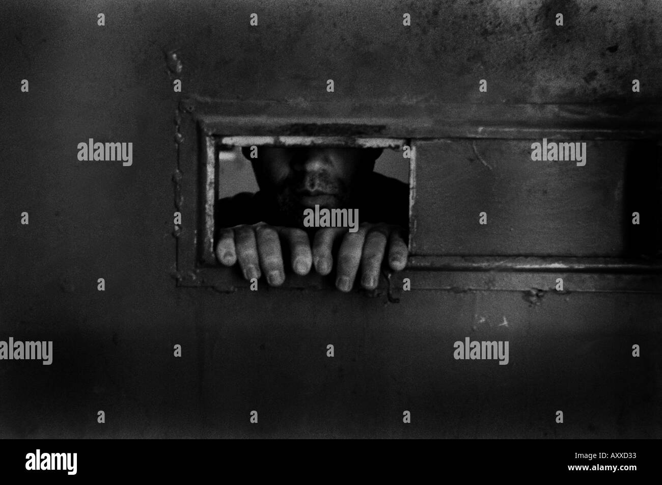 INMATE LOOKING THROUGH FROM HIS SMALL CELL S WINDOW, Sinop Prison, Turkey, 06/03/2005 Stock Photo