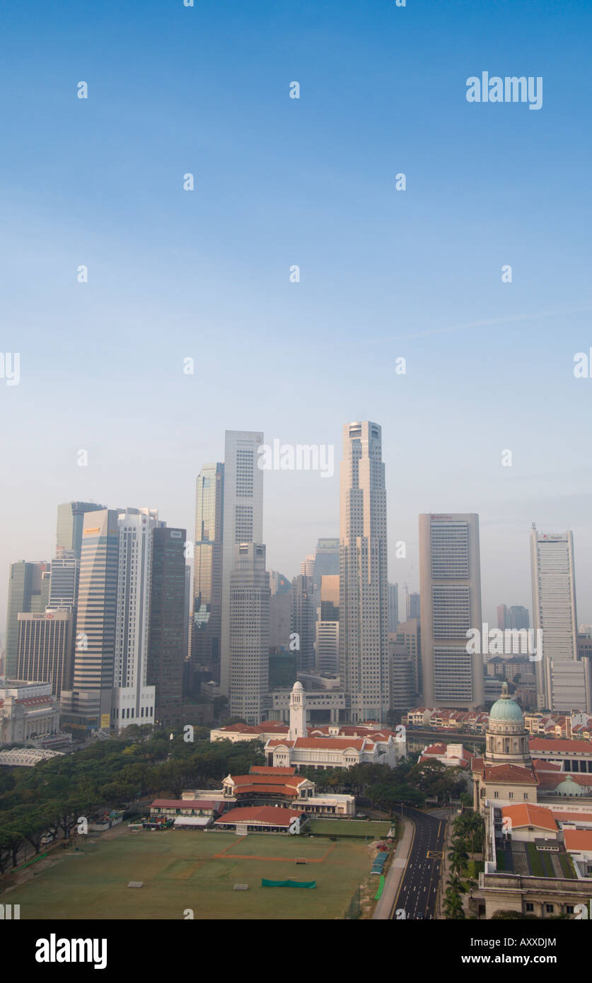 Singapore skyline with the Padang and Colonial District in the foreground, Singapore, South East Asia Stock Photo