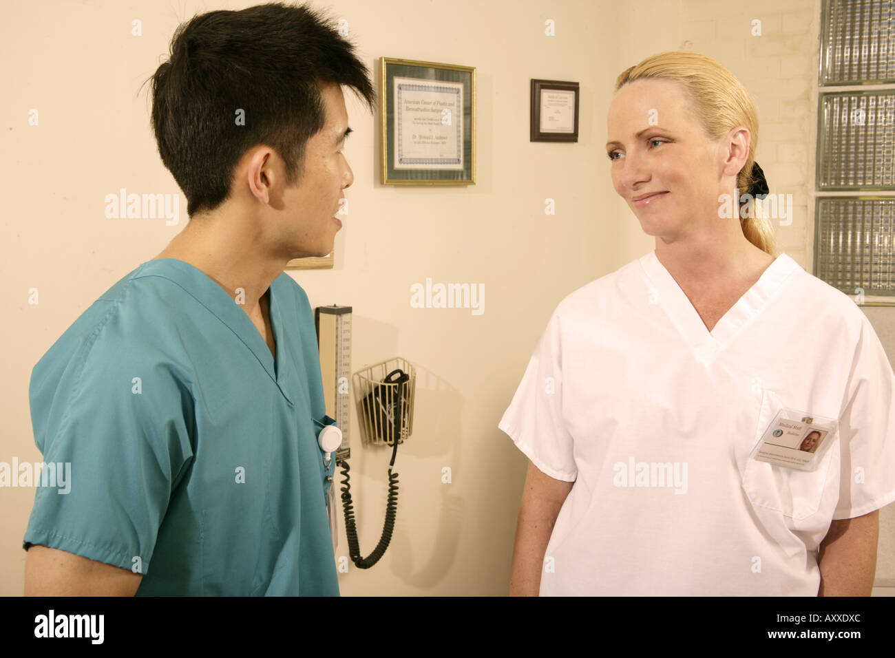 Medical staff talking in the medical exam room. Stock Photo