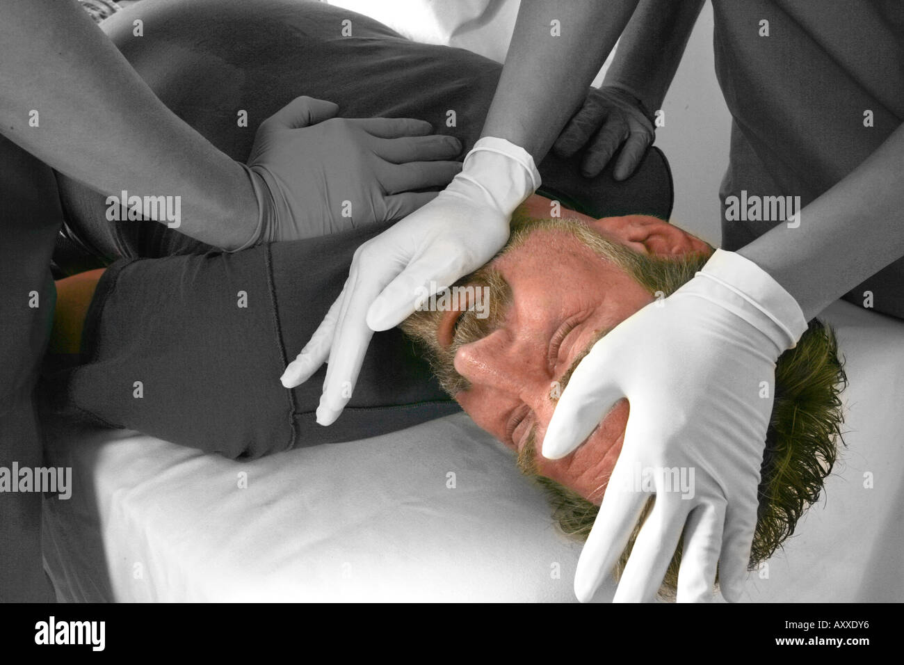 Psychiatry attendees restrain a patient. Stock Photo