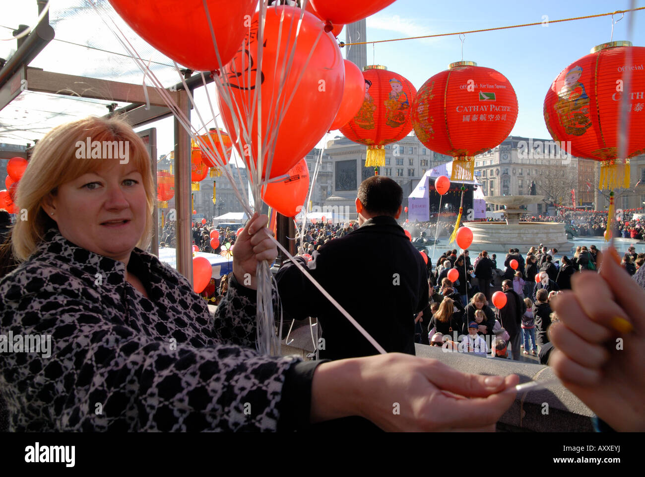 Giving out balloons at the Chinese New Year in Trafalgar Square Stock Photo