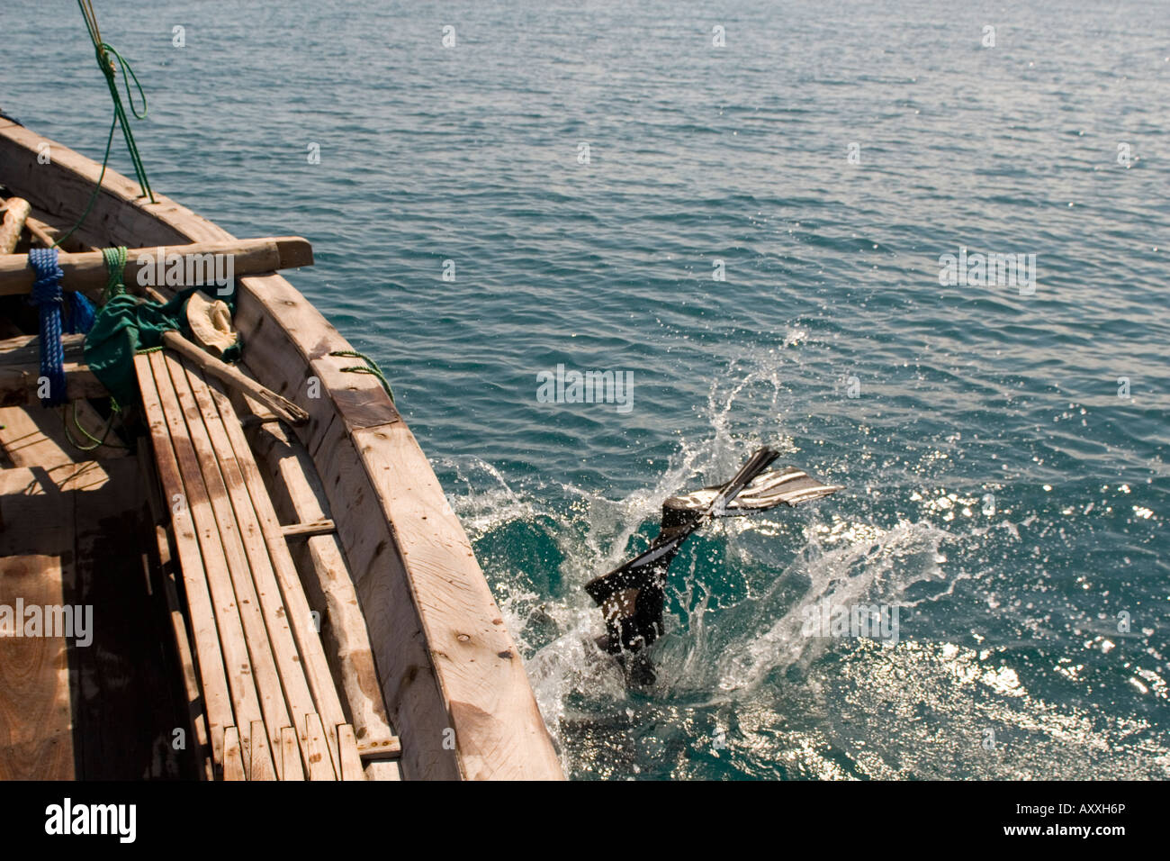 Scuba diver entering water in Chole Bay off Mafia Island Tanzania Stock