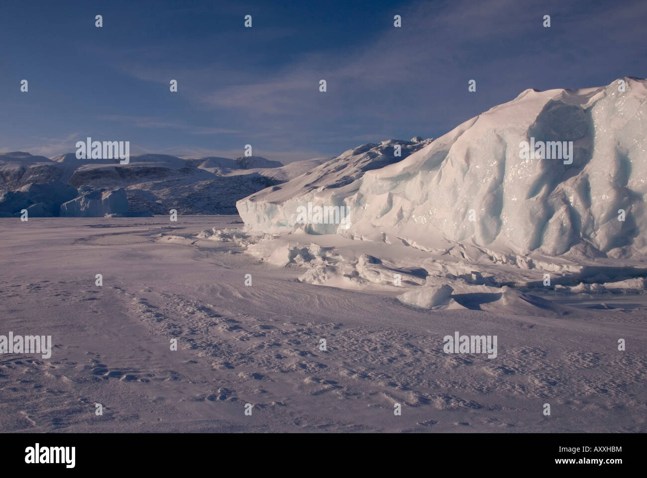 An iceberg frozen into the sea in the Davis Strait, Greenland Stock Photo