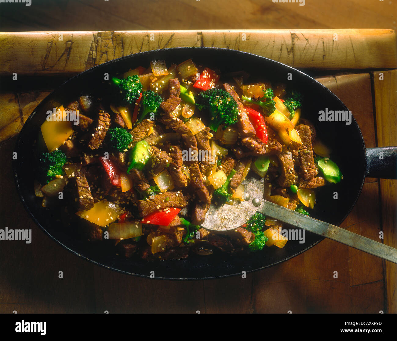 Pan fried beef fillet with sesame seeds broccoli red yellow peppers