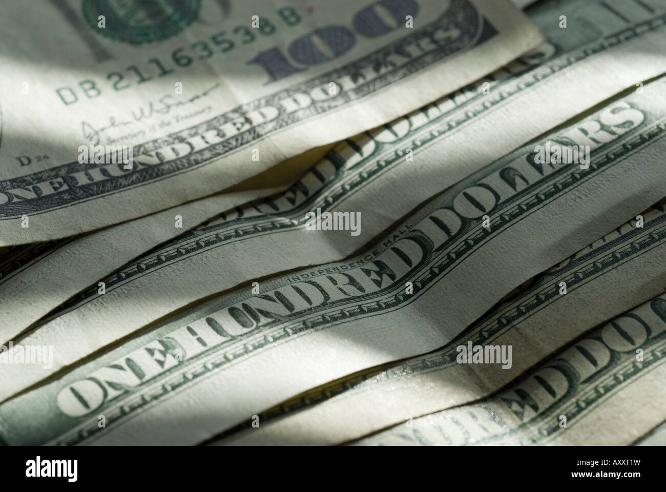close-up-of-hundred-dollar-bills-focus-on-one-hundred-AXXT1W.jpg