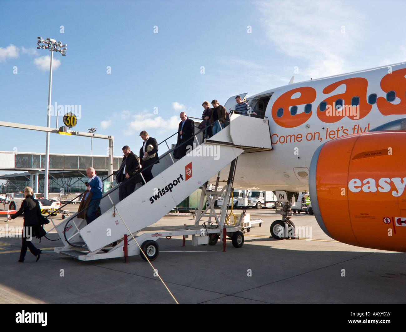 passengers disembarking EasyJet flight, Stansted airport, England, UK Stock Photo