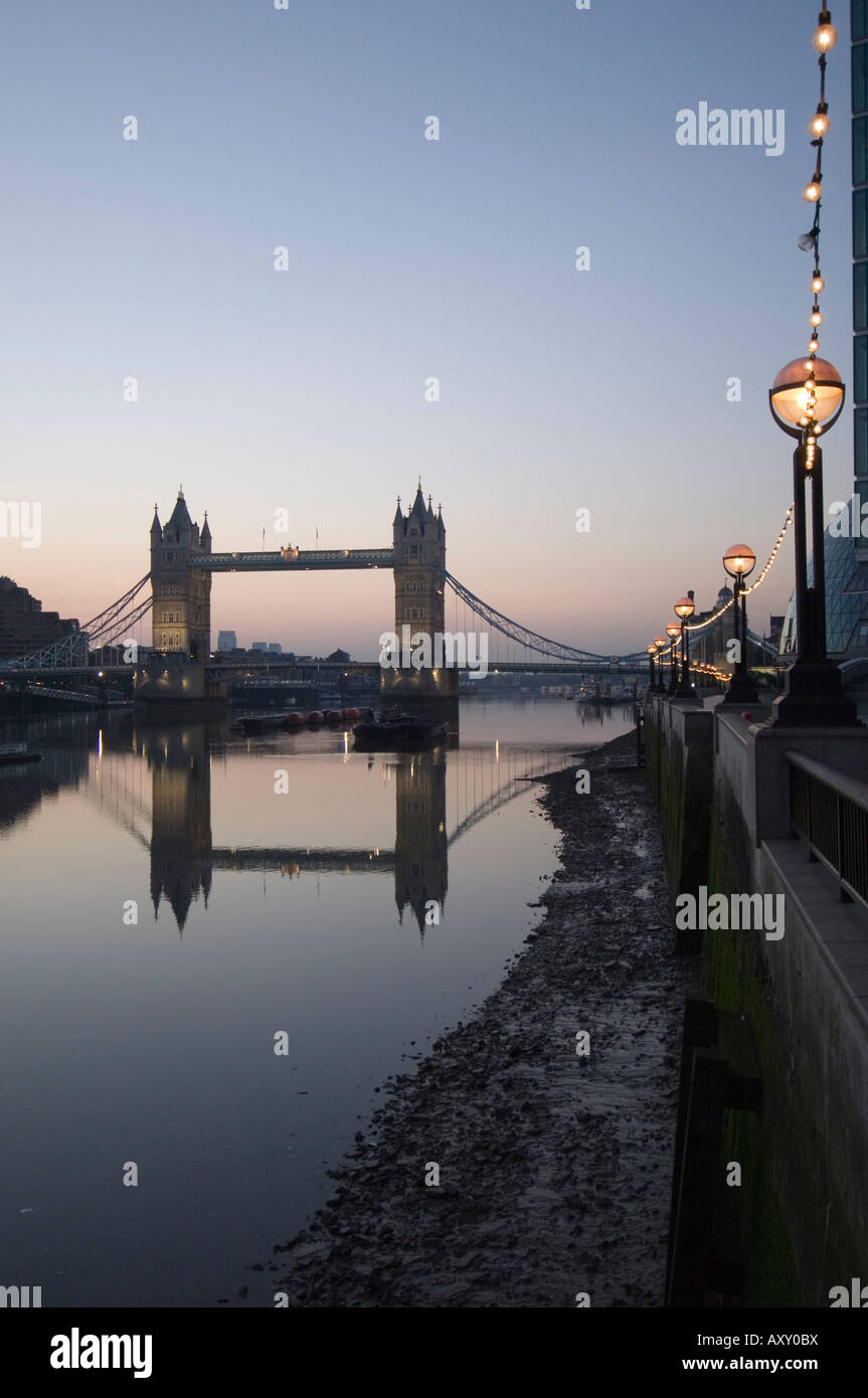 Tower Bridge reflected in the calm water of the River Thames in the early morning, Londonn, England, United Kingdom, Europe Stock Photo