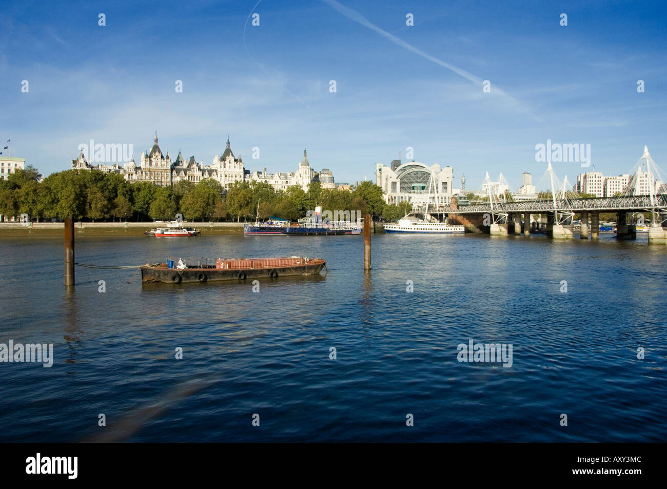 View across the river Thames in central London with the Golden Jubilee footbridge and Hungerford