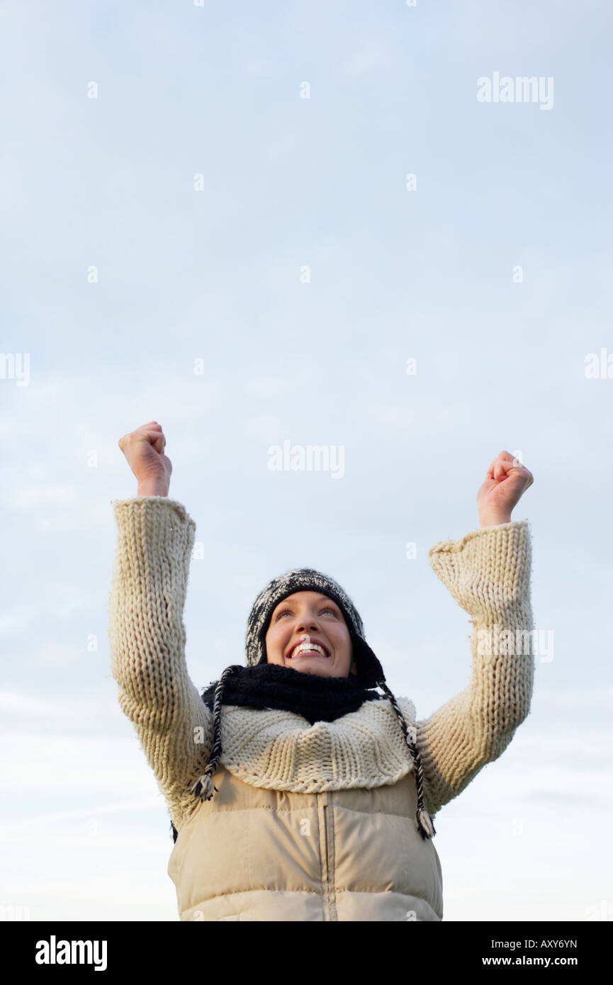 Woman arms up looking sky hi-res stock photography and images - Alamy