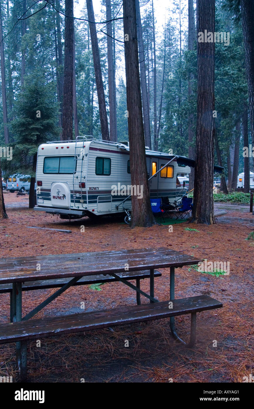 RV Camper camping in forest during spring rain storm North Pines