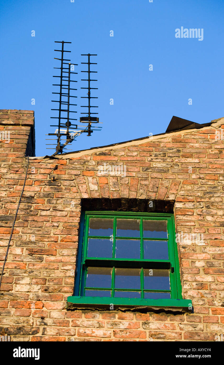 Old brick building with three ariels in York Stock Photo