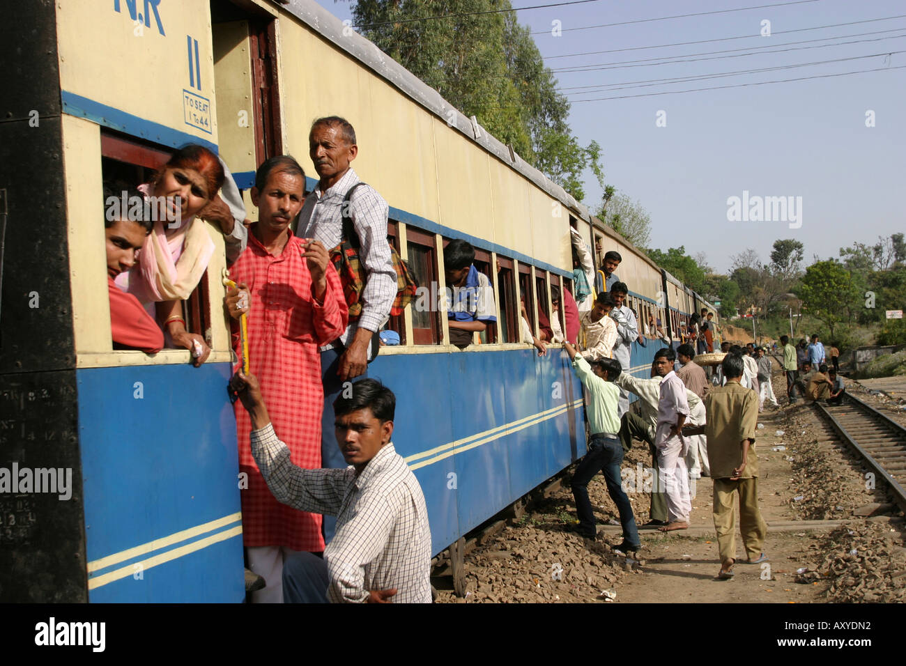 India Himachal Pradesh transport passengers boarding rural train on narrow gauge line to Pathankot Stock Photo
