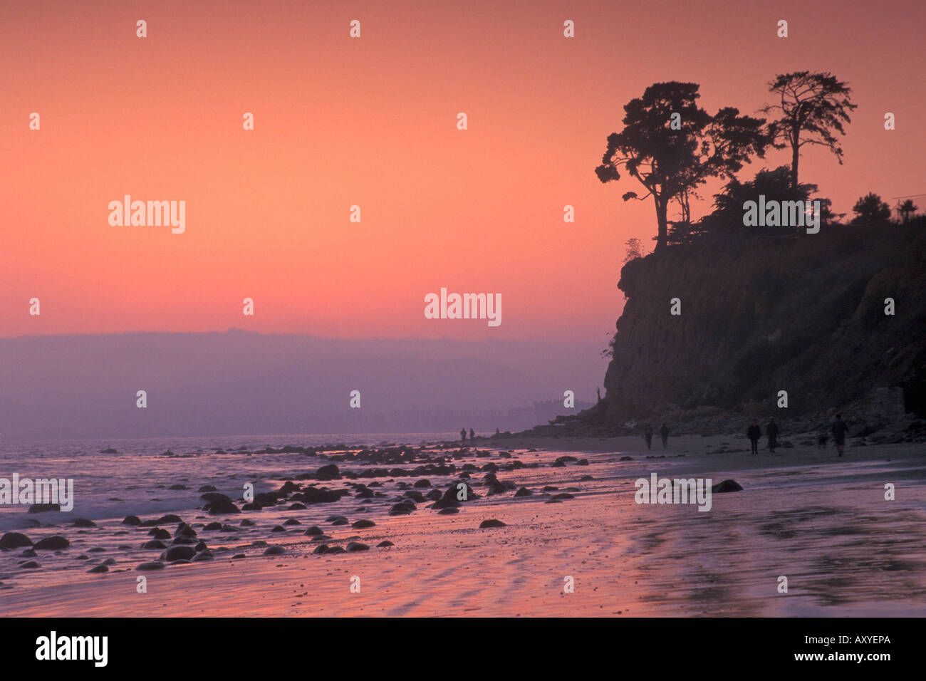 People walking on sand at Butterfly Beach at sunset Santa Barbara California Stock Photo