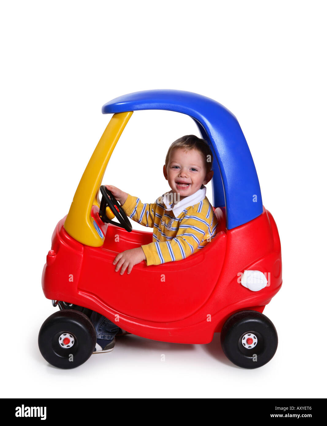 Boy in Toy Car Stock Photo