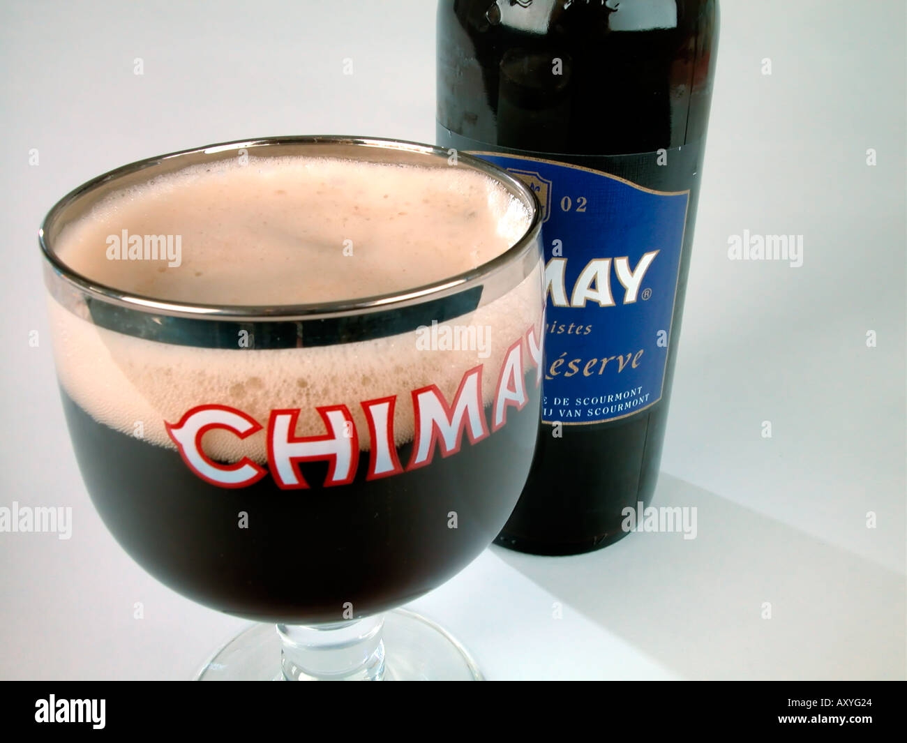 Bottle and glass of Chimay Trappist beer brewed at Abbaye de Notre Dame de Scourmont Forges Belgium Capsule Bleue 7 1 Stock Photo