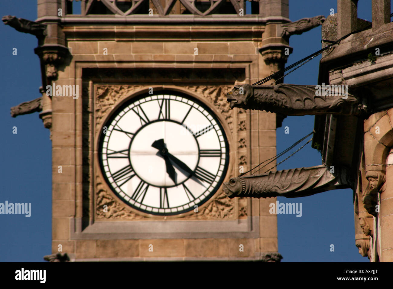 Gargoyle and clock tower detail in Ghent Belgium Stock Photo