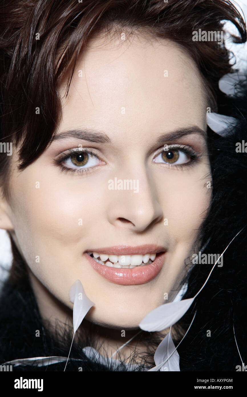 studio shot portrait of a smiling young and beautiful french woman on isolated background Stock