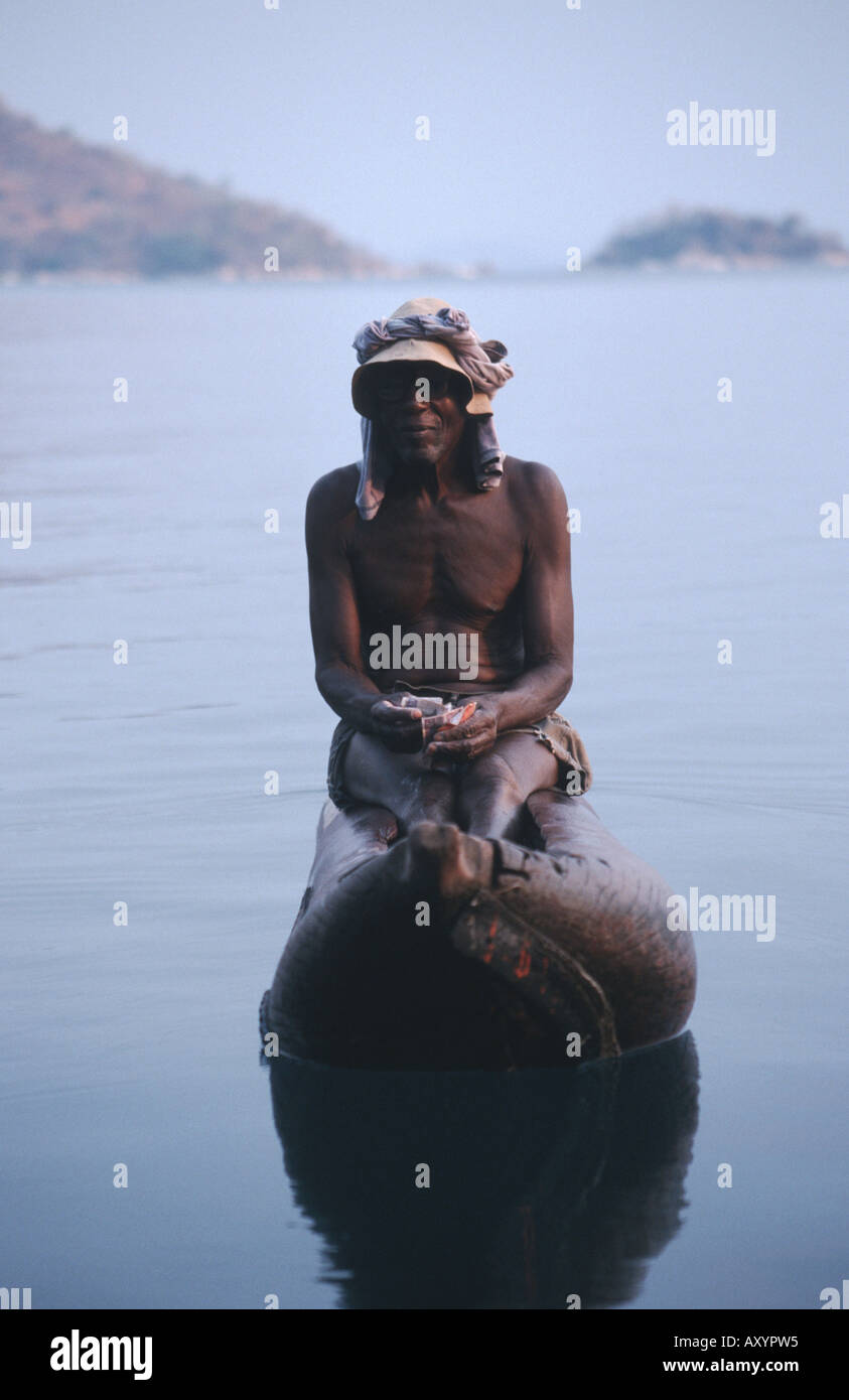 old man on a logboat on the Malawi-lake, Malawi, Malawi Stock Photo