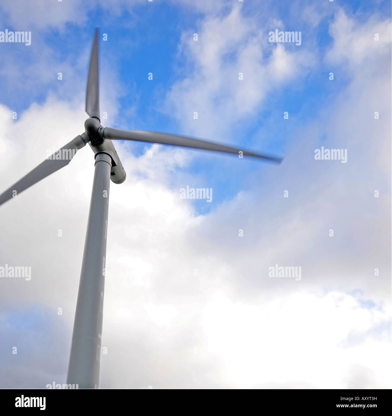 Wind Turbine against blue sky with clouds Stock Photo - Alamy