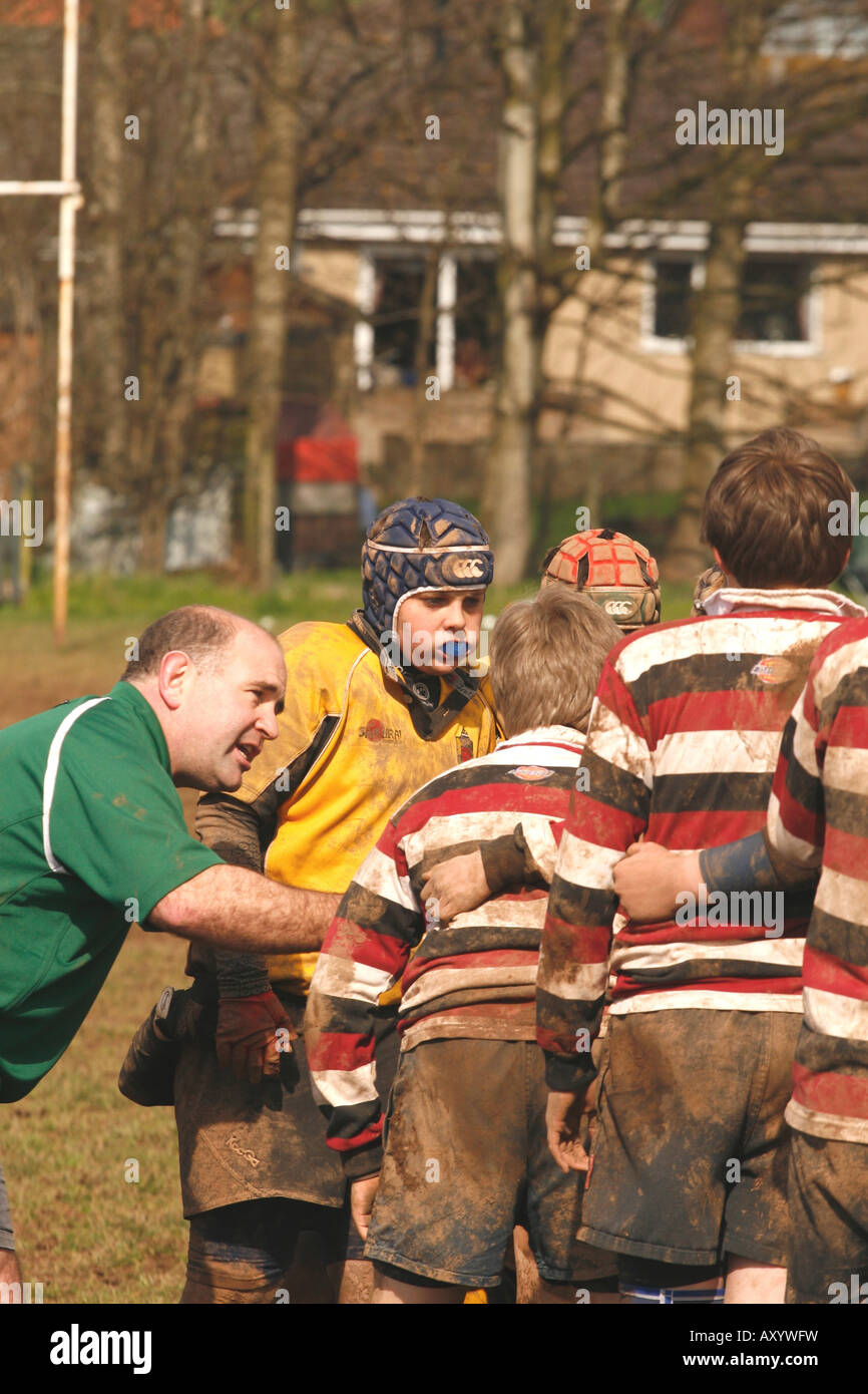 Junior rugby match Under 12 players listen to the match referee explaining the scrum technique EDITORIAL USE ONLY Stock Photo