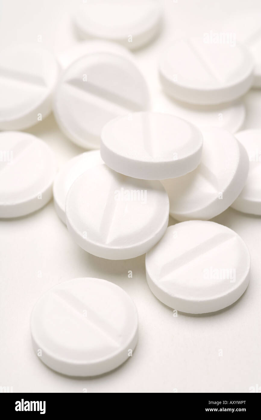 Painkillers medicine white pills drugs or tablets aspirin or paracetamol pain killers Stock Photo