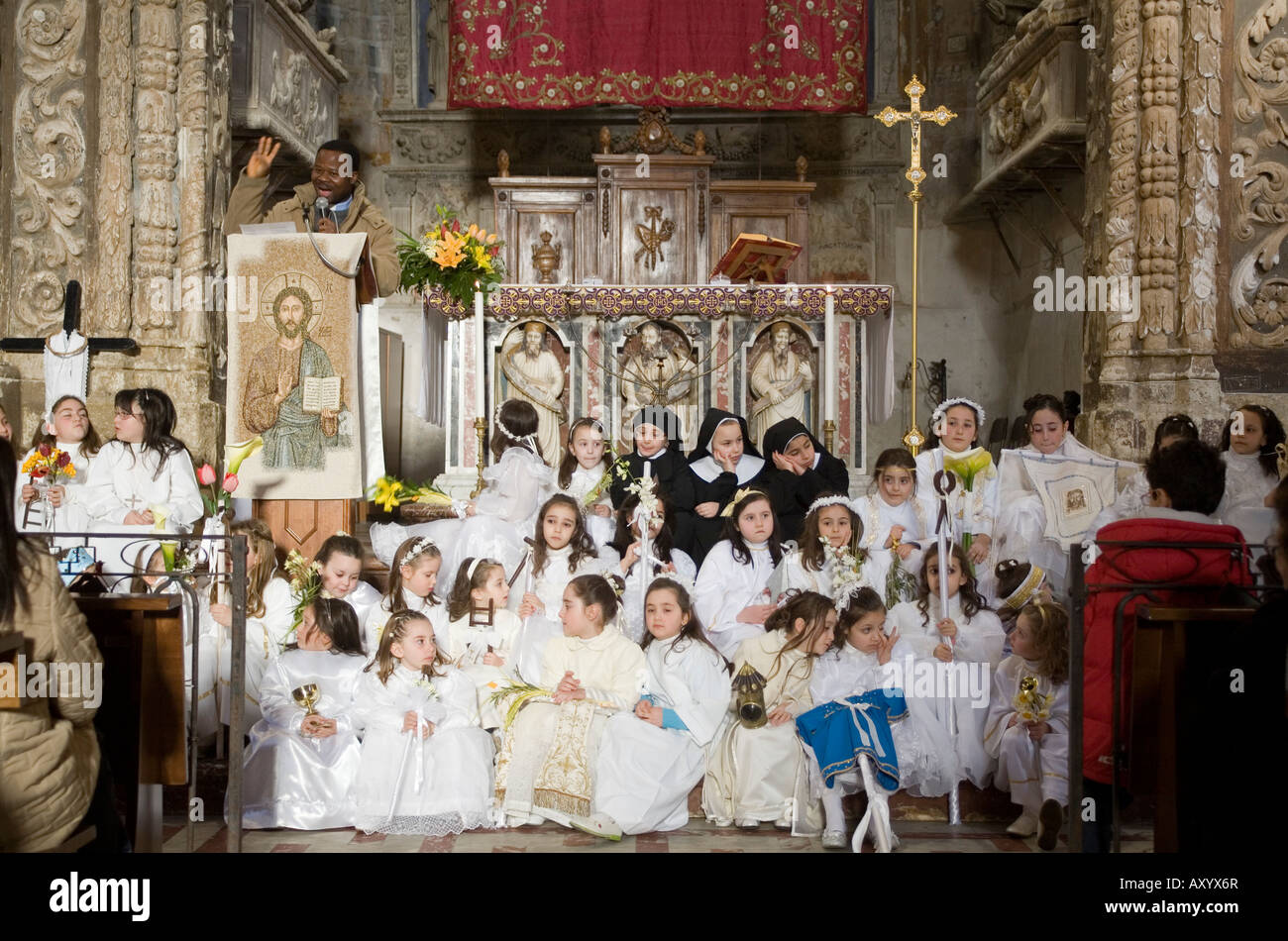 Priest celebrating the Easter mass Assoro Enna Sicily Italy Stock Photo