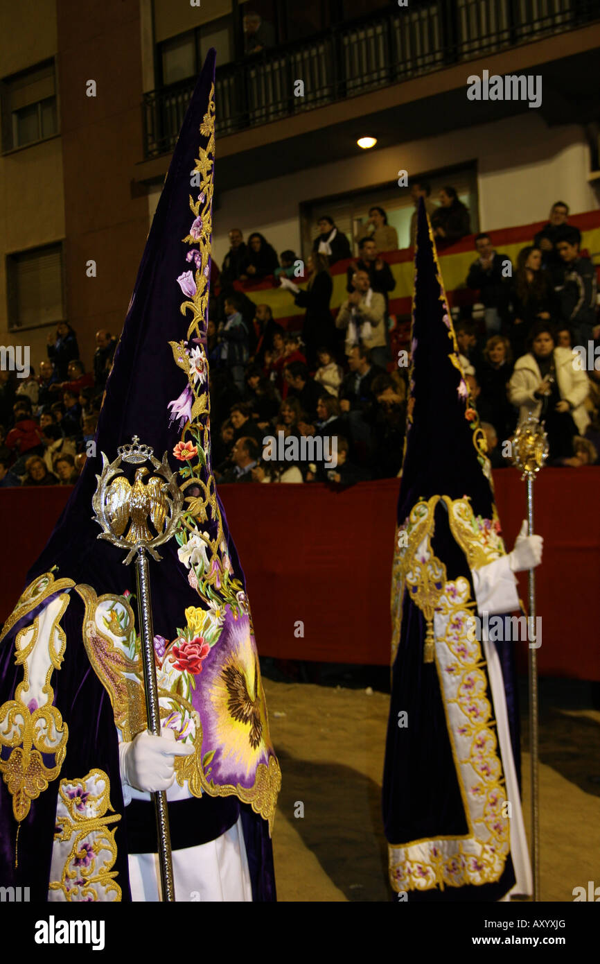 Two nazarenos wearing robes embroidered in gold and silk thread, Paso  Blanco, Semana Santa, Lorca Stock Photo - Alamy