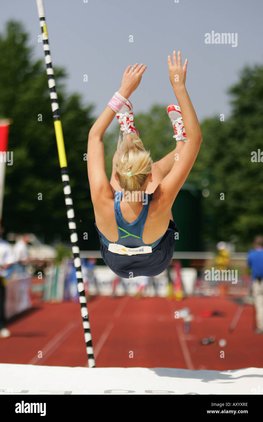 motionsequence pole vault, fall onto the mat after jumping Stock Photo